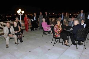 Picture of people on rooftop patio at night